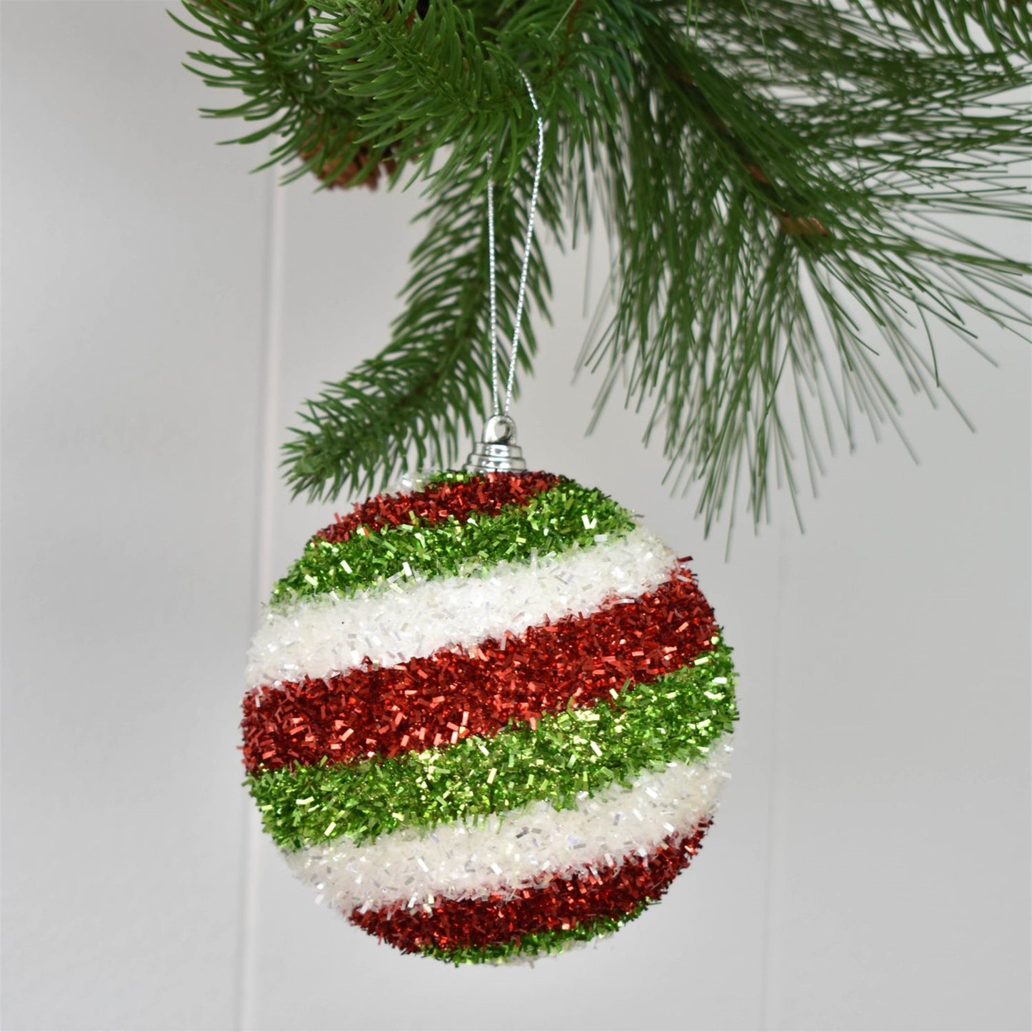 4" Horizontal Stripe Cut Tinsel Ball Ornament in White/Red/Green | FY