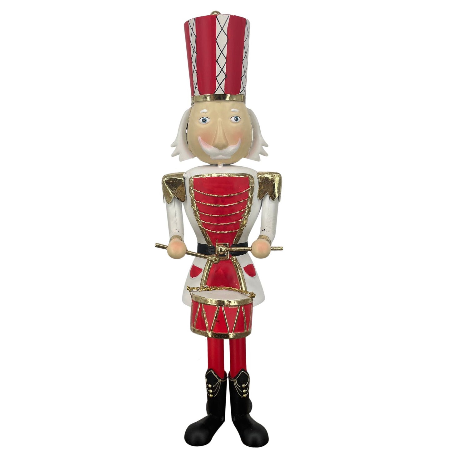 A traditional metal Christmas nutcracker figurine dressed in a red and white uniform with gold trim, a red and white striped hat, and black boots, holding a small drum against a plain white background.