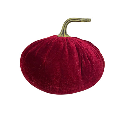 Red velvet plush pumpkin with a realistic green stem on a white background