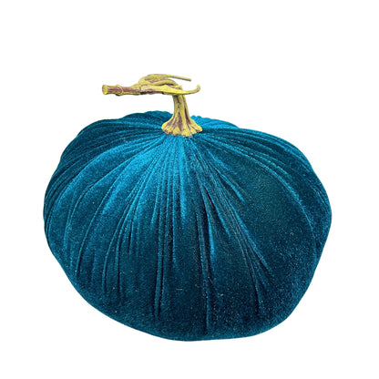 Blue velvet pumpkin with a yellow stem on a white background