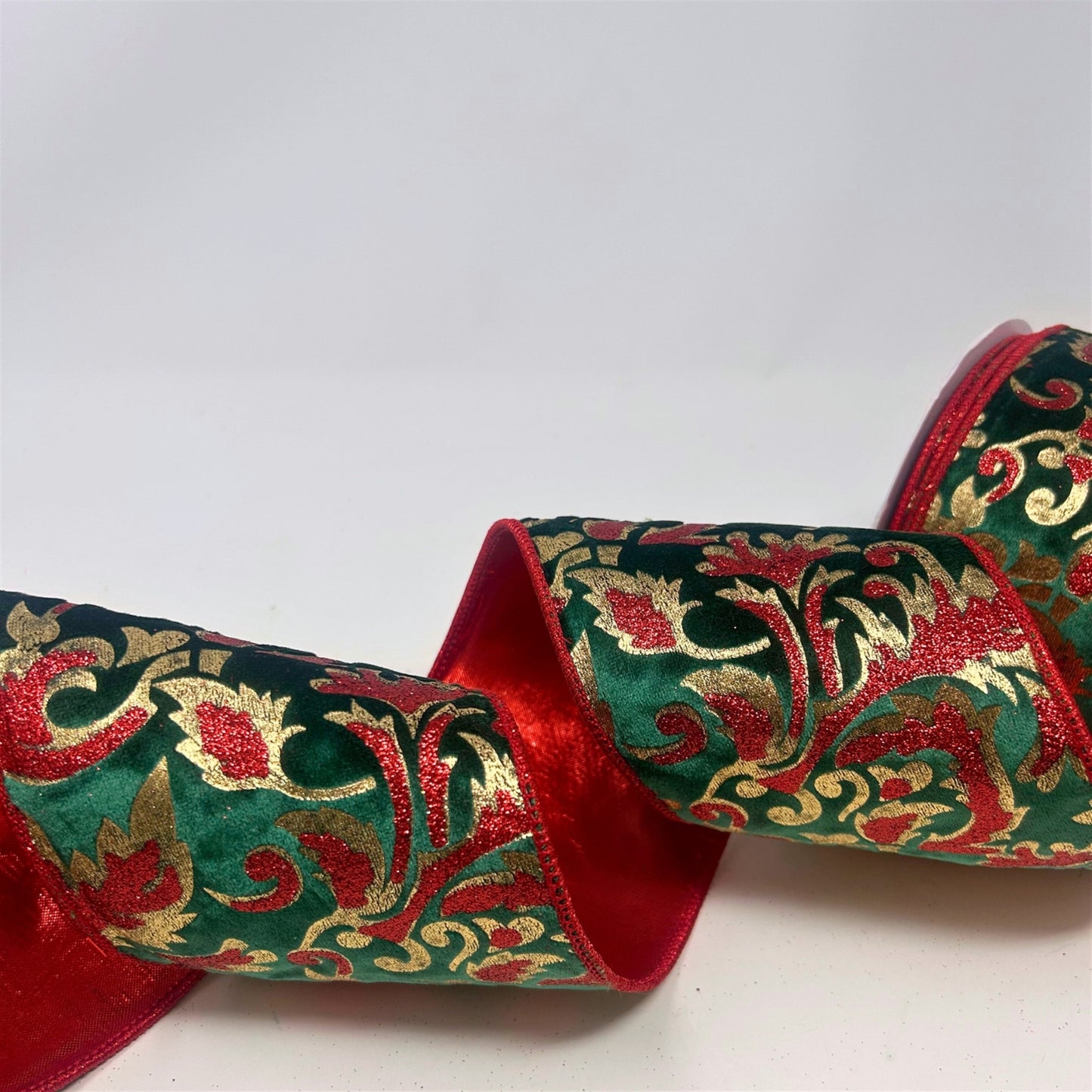 Glitter Print Leaf Pattern on Dark Green Velvet Ribbon w/ Red lame back 4” x 10yd | IR